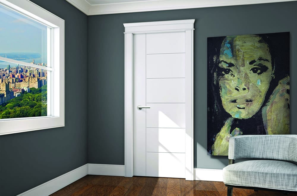 White interior door with trim in a finished room